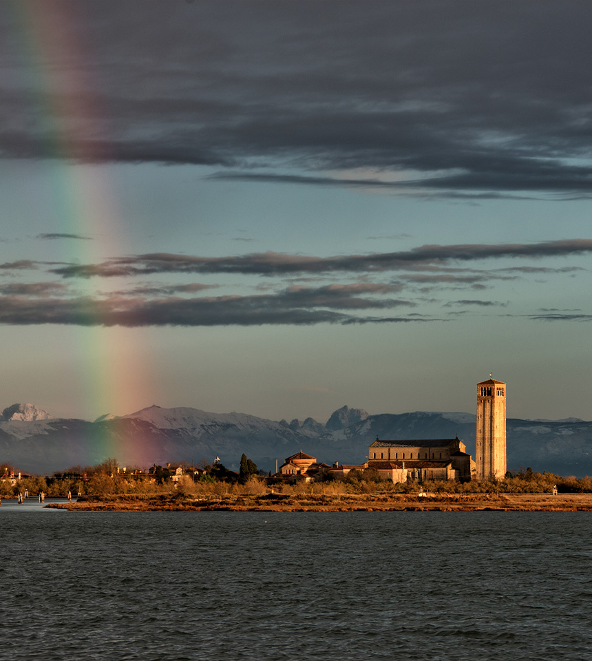 Man Using Measuring Tape in Factory Setting Man Using Measuring Tape in Factory Setting